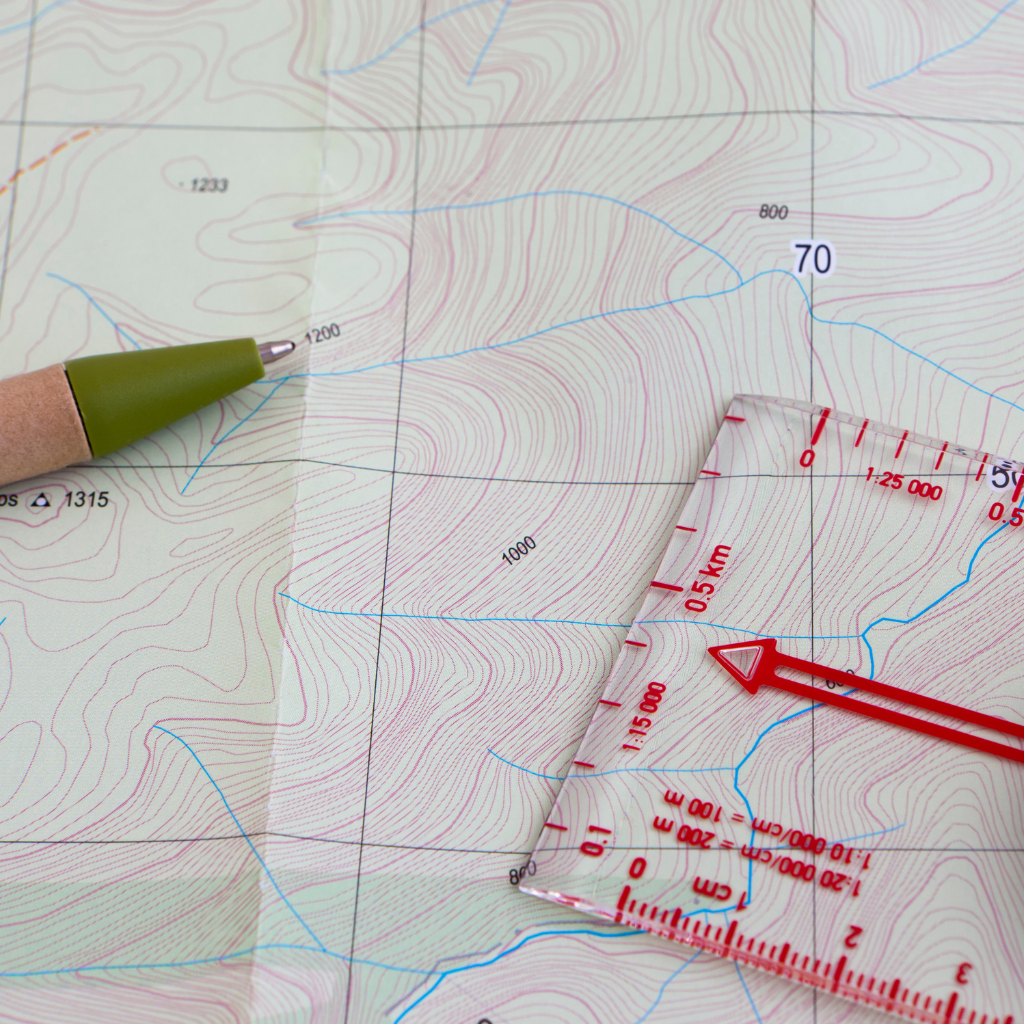 Map With Compass And Pen To Figure Out How Long Does It Take To Hike A Mile