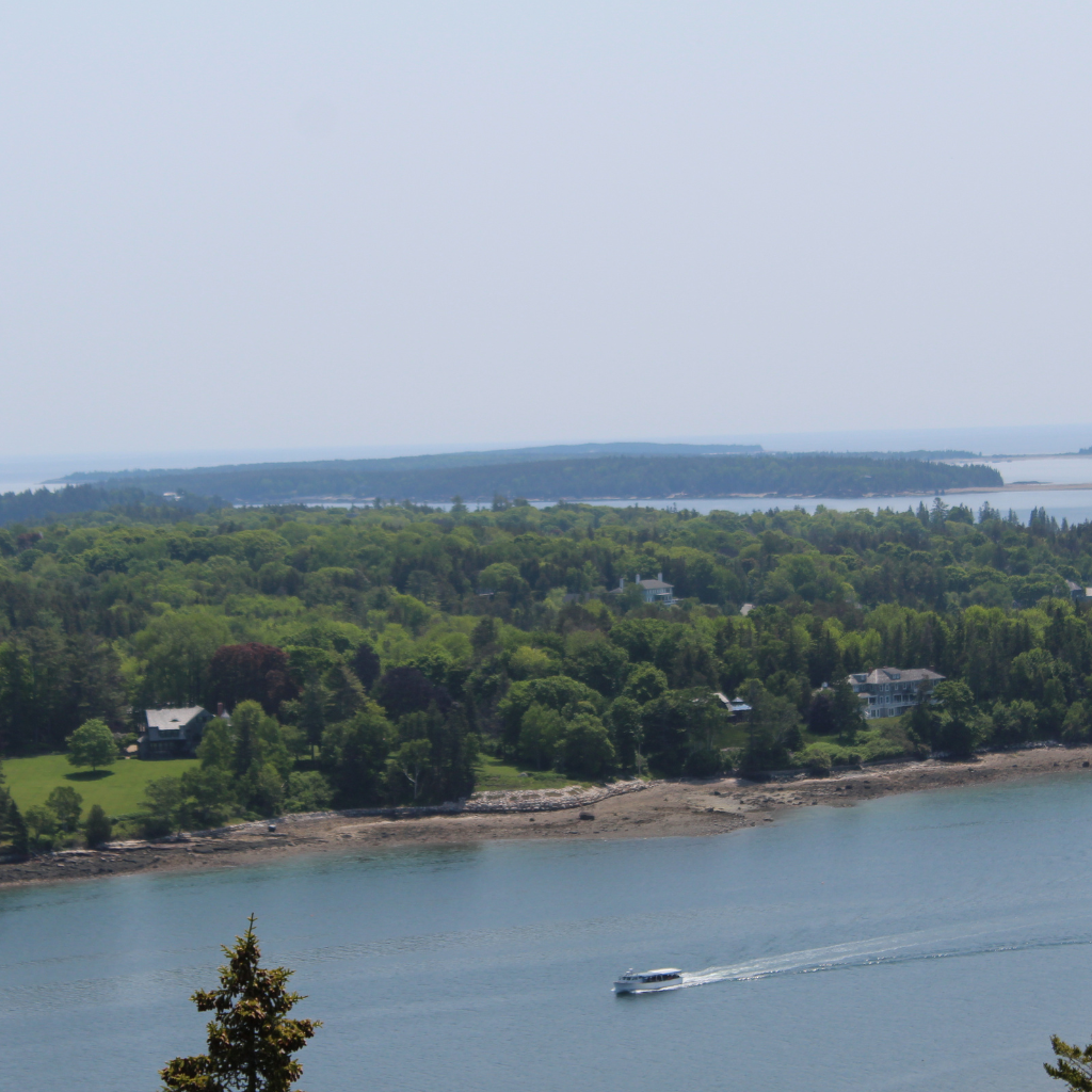 View overlooking Somes Sound Entrance with a tour boat going through from Flying Mountain Acadia National Park