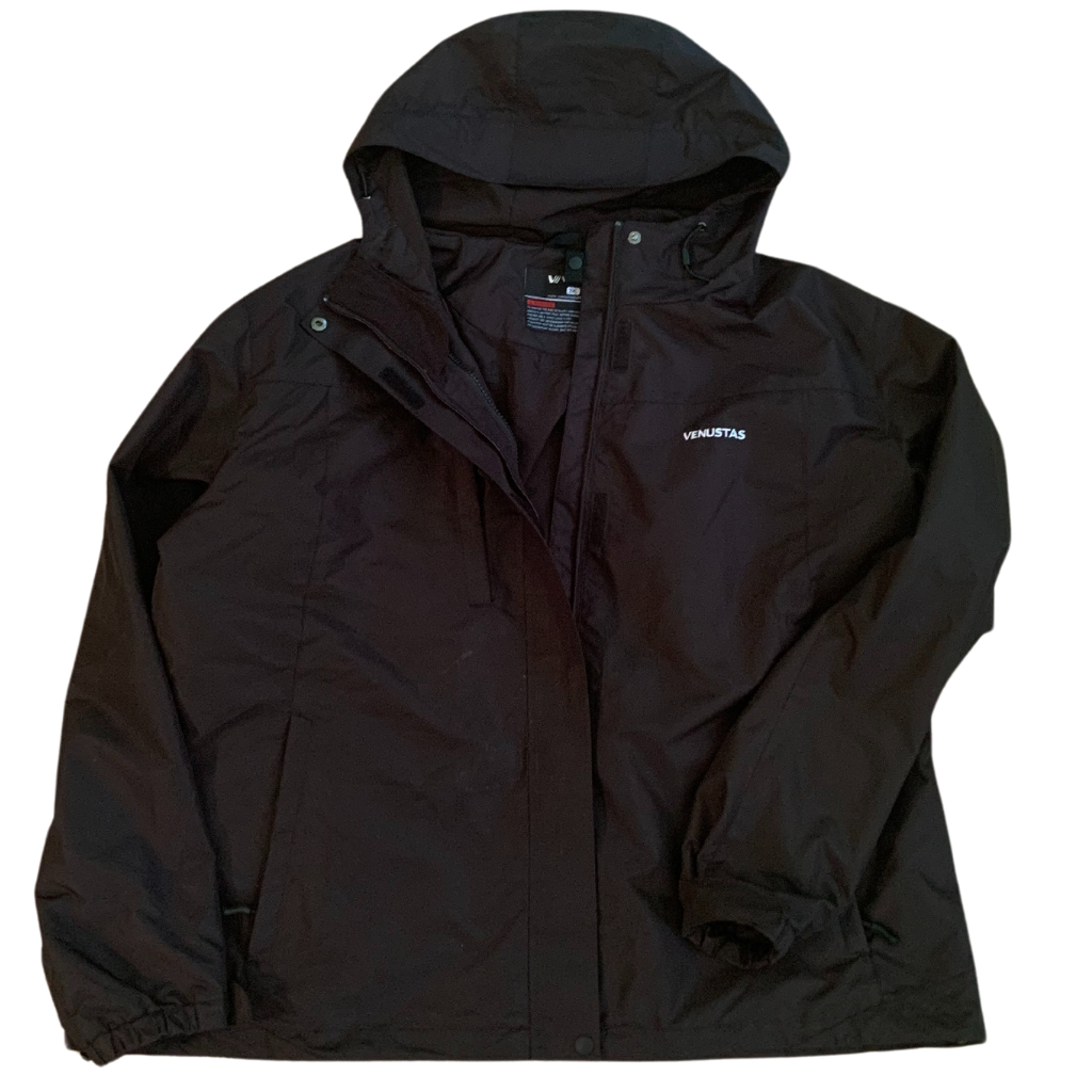 Black shell of the Venustas jacket with the hood open